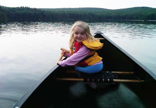 child in canoe